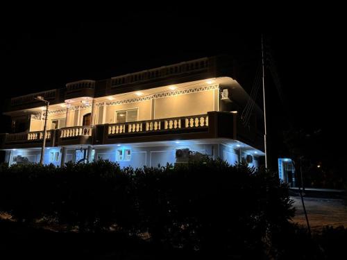 a large building with lights on it at night at wawat in Abu Simbel