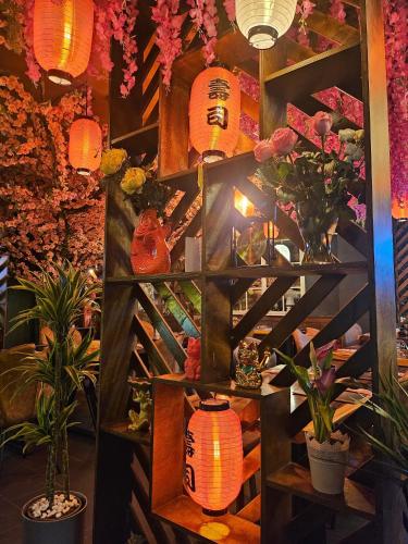 a room with a bunch of flowers and lanterns at Hotel Schloßschenke in Idar-Oberstein