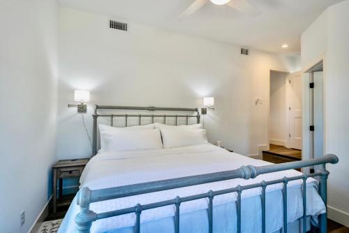 a bedroom with a large bed with white sheets at Ranchview Retreat in the heart of Johnson City in Johnson City