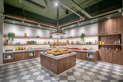 a large kitchen with a large island in the middle at INNSiDE by Meliá São Paulo Higienópolis in Sao Paulo