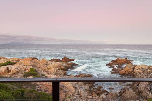 a view of the ocean from a balcony at Rocky Bay on the View in Gordonʼs Bay