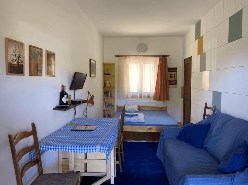 a living room with a couch and a table at Kerca Bio Farm in Kercaszomor