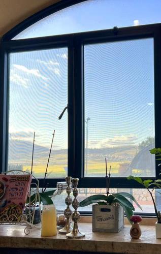 a window with a view of an airport at מול השדות-הווילה in Temarah
