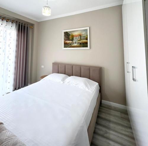 Llit o llits en una habitació de Soffi Apartament