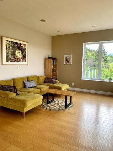 a living room with a couch and a coffee table at Eagles Perch in Margaree