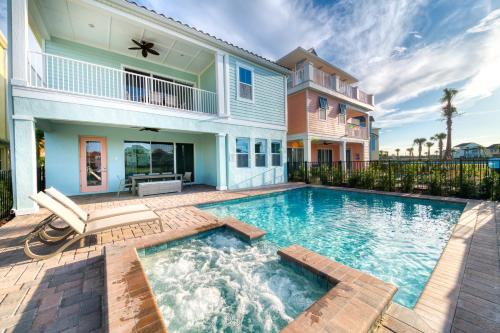 a swimming pool in the backyard of a house at Margaritaville Cottages Orlando with H2O Waterpark by Rentyl in Kissimmee