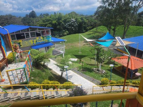 a view of a park with a roller coaster at Alojamiento el jardin in Filandia