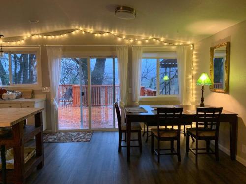 a kitchen and dining room with a table and chairs at Riverbed House in Middletown