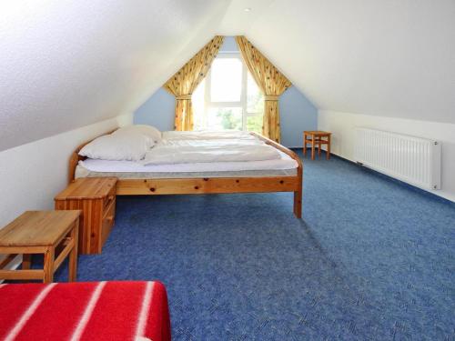 a bedroom with a bed in a attic at Ferienwohnung, Röbel an der Müritz in Röbel