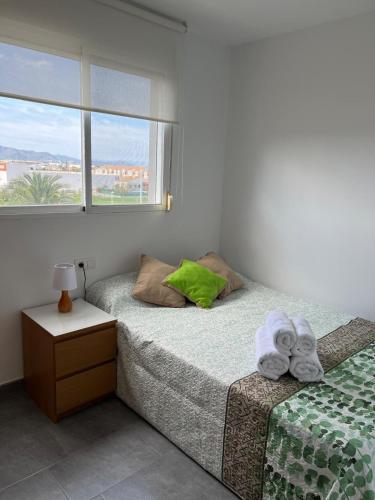 a bedroom with two twin beds and a window at Moncofa Sunset in Moncófar