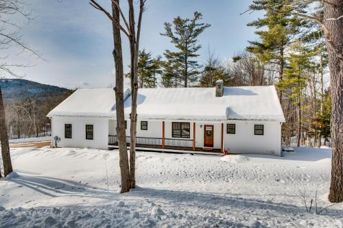 a white house in the snow at 6 Mi to Lake Winnipesaukee New Hampshire Home in Gilford
