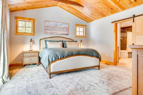 a bedroom with a bed and a wooden ceiling at 6 Mi to Lake Winnipesaukee New Hampshire Home in Gilford