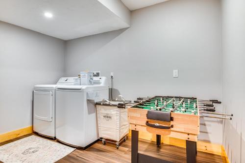 a kitchen with a counter and a table in a room at 6 Mi to Lake Winnipesaukee New Hampshire Home in Gilford