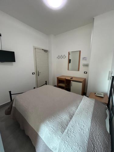 Ένα ή περισσότερα κρεβάτια σε δωμάτιο στο Hotel Marchina