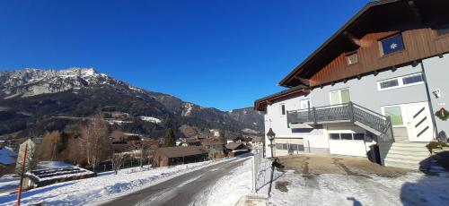 a building on the side of a snow covered mountain at Panoramatraum in Gersdorf