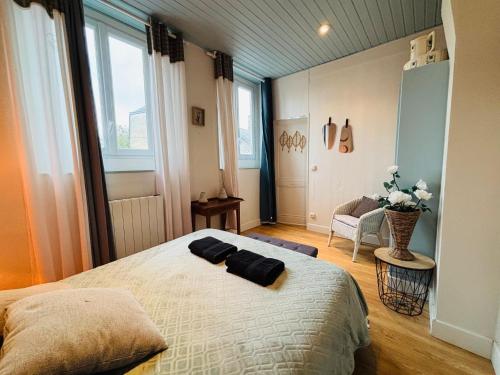 Posteľ alebo postele v izbe v ubytovaní jolie cottage idéalement située
