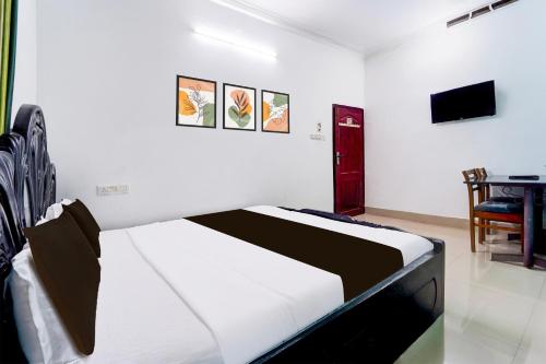 Postel nebo postele na pokoji v ubytování Hotel O Libra Regency