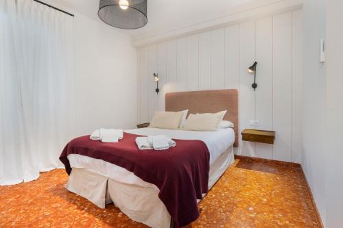 En eller flere senge i et værelse på Mara Arenal Sevilla