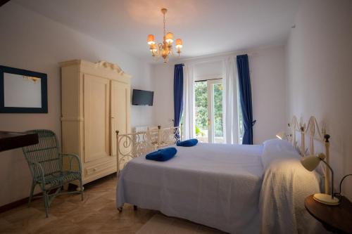Postel nebo postele na pokoji v ubytování Villa Gelsomini