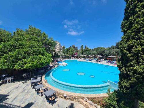 an overhead view of a swimming pool at a resort at Basilica Holiday Resort Apts in Paphos
