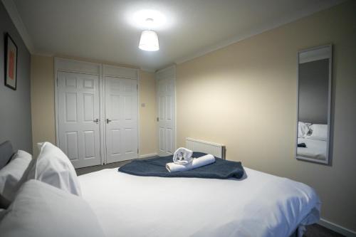 a bedroom with a bed with a towel on it at Couver House in Livingston
