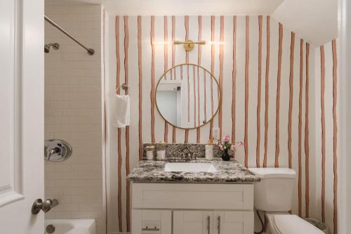 a bathroom with a sink and a mirror at Victorian Retreat in Barrio Logan 1mi to Downtown in San Diego