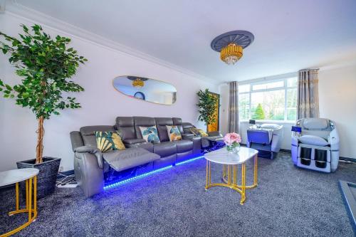 a living room with a couch and a table at -CH- Stylish & Relaxed Stay,Free Parking,Free WiFi in Batley