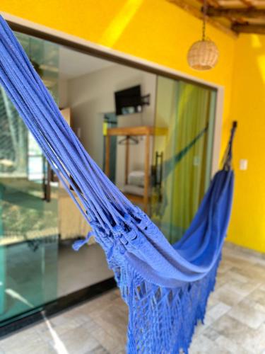 a blue hammock hanging in a room at Pousada Cigarras da Serra in Serra do Cipo