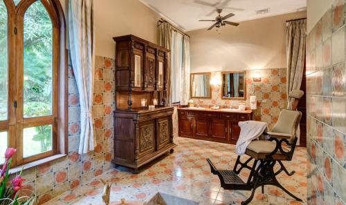a bathroom with a sink and a mirror at El Castillo de Esparza in Esparza