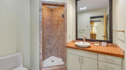 a bathroom with a sink and a shower at Meadow House - Unit 56 in Sunriver