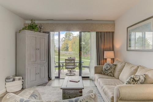 a living room with a couch and a table at Gorgeous Chic Beach Front Condo 2775 in Traverse City