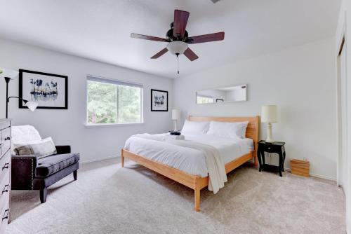 a bedroom with a bed and a ceiling fan at 3BR family home with backyard in Austin