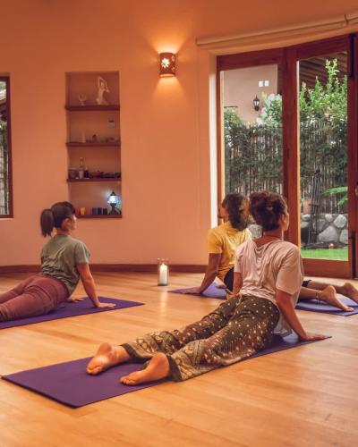 a group of women sitting in a yoga class at Stunning 1BR House in Camino Real in Urubamba