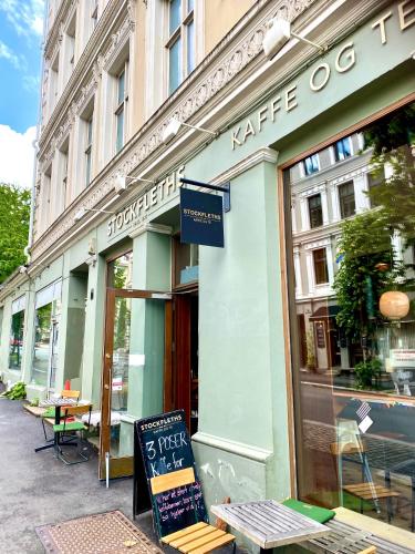 a store with a sign in front of a building at RELAXED LIVING No 02 Historic Oslo in Oslo