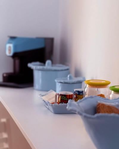 a counter with jars of food on top of it at Relais San Giovanni srls in Castellaneta