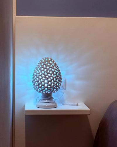 a lamp sitting on a table in a room at Relais San Giovanni srls in Castellaneta