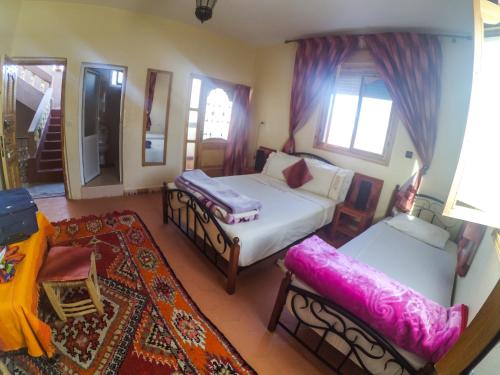 Postel nebo postele na pokoji v ubytování Maison Tigmi Ozro