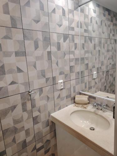 a bathroom with a sink and a mirror at Lovely apartment in Cascais Park in Cascais