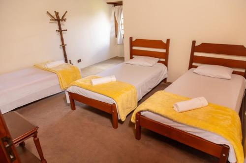 Postel nebo postele na pokoji v ubytování Casa das Montanhas - Aconchego e Tranquilidade à 2,4km do Capivari