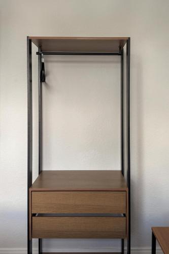 a metal and wooden shelf in a room at Ap Expo SP e Zoológico in Sao Paulo