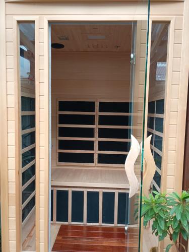 a glass door of a house with a balcony at Romanic Garden View 1 bed Apartment with ocean views at Stanwell Tops in Stanwell Park