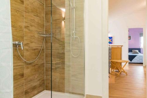 a bathroom with a shower with a glass door at Holiday home in Jakovici - Istrien 53392 in Bašići
