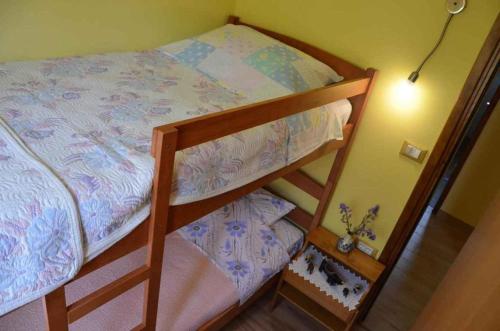 a bedroom with a bunk bed and a night stand at Holiday home in Tinjan - Istrien 51828 in Tinjan
