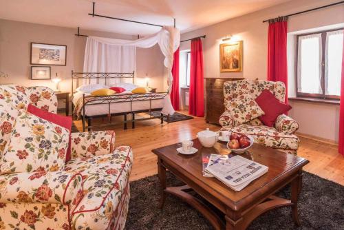 a living room with two chairs and a coffee table at Holiday home in Merisce - Istrien 53394 in Merišće