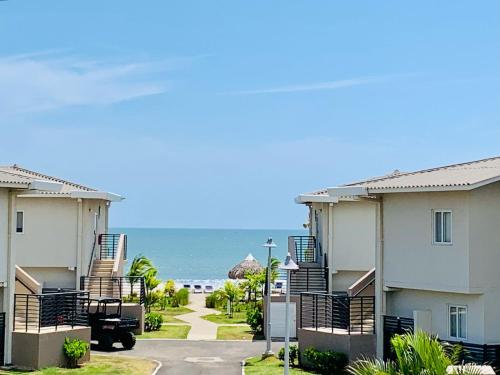 a view of the beach from the apartment buildings at Beach Home at Playa Caracol in Chame