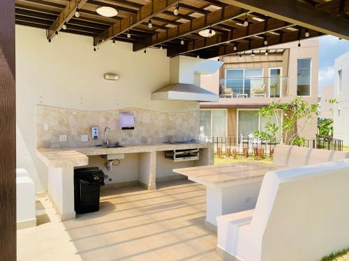 an outdoor kitchen with a counter and a sink at Beach Home at Playa Caracol in Chame