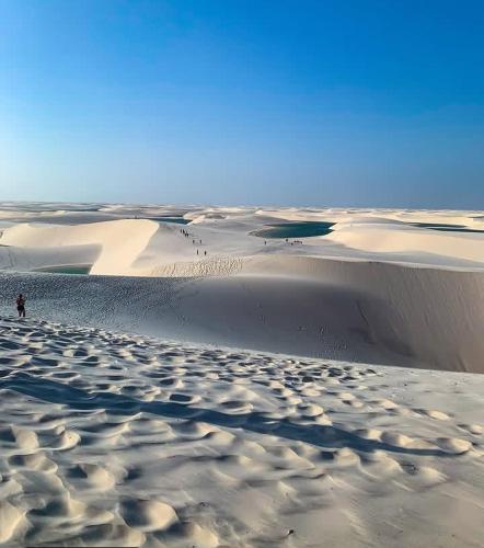 a person standing on top of a sand dune at Estadia in São Luís