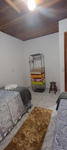 Postel nebo postele na pokoji v ubytování Aconchego da Jô
