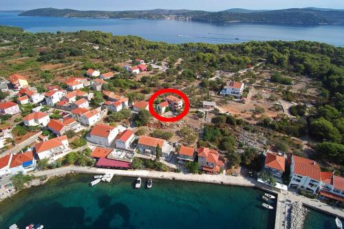 an aerial view of a house with a red circle at Apartments with parking space Bozava, Dugi otok - 23903 in Božava