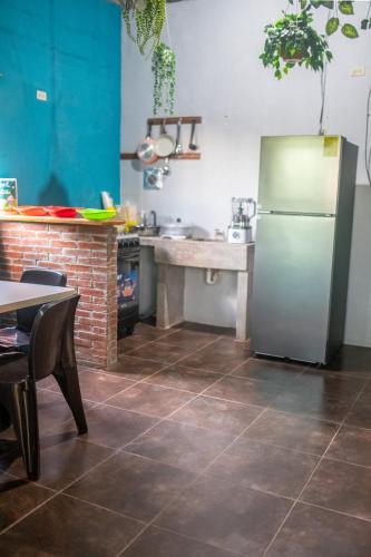 A kitchen or kitchenette at Bambu Hostel